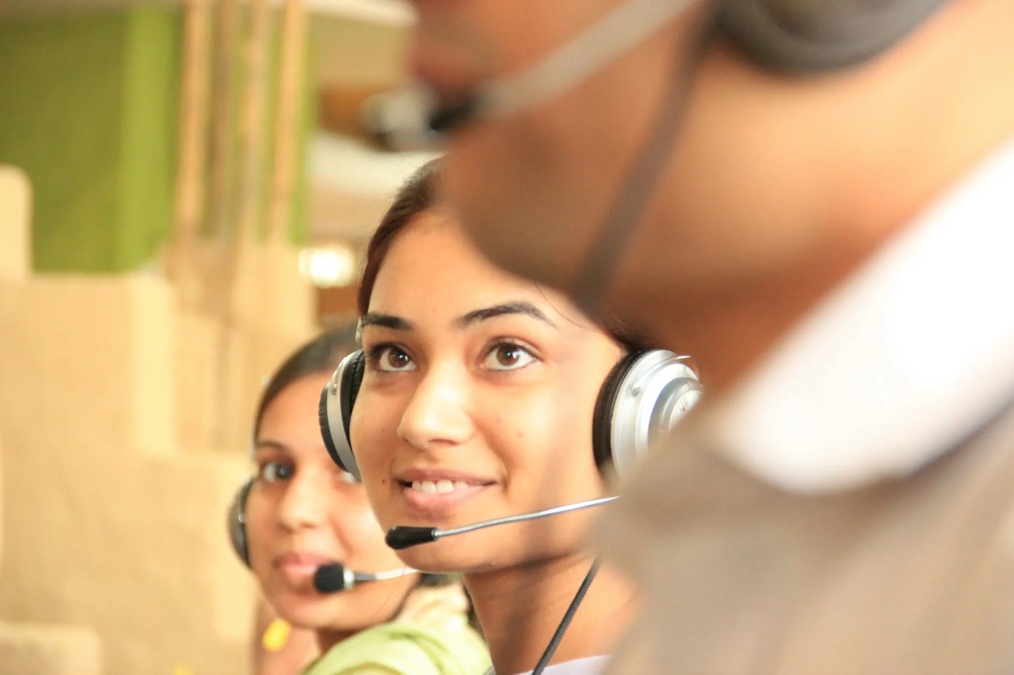 Advisers wearing headsets, ready to help