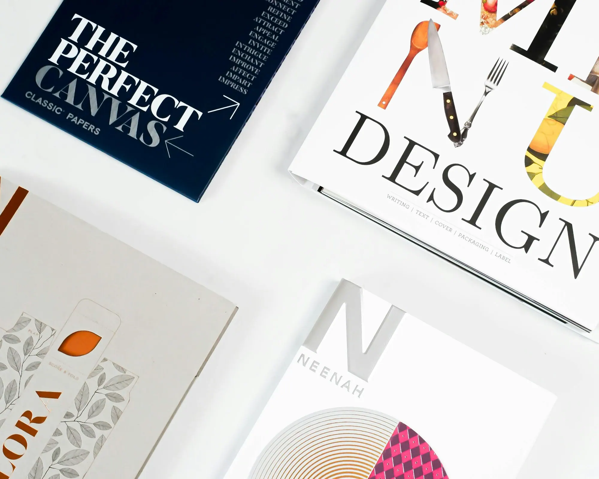 Design books and printed materials laid on a table